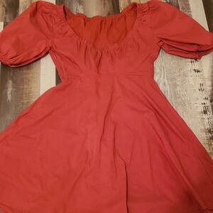 Cute burnt orange short dress. Zipper on the side.